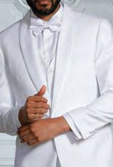 An individual in the INSOMNIA SUNSET 3PC Slim Fit White Tuxedo Suit from Insomnia adjusts their jacket, complete with its reversible vest and bow tie.