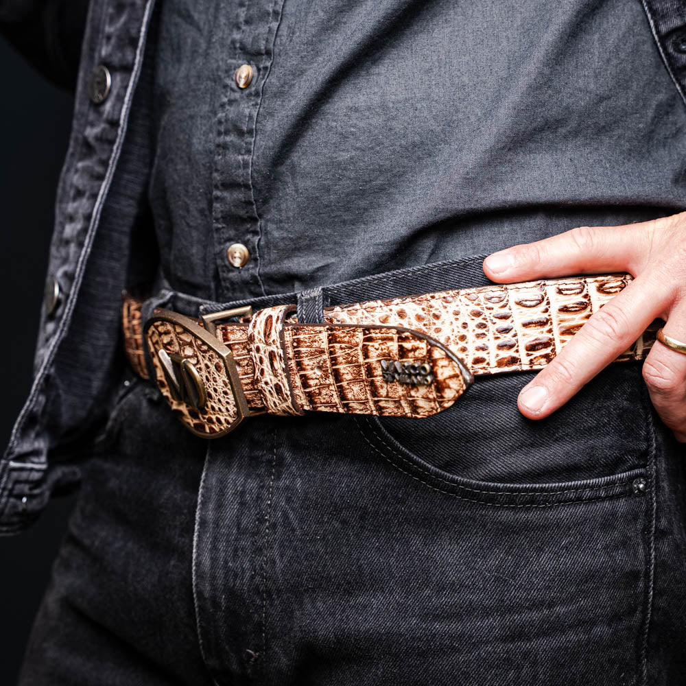 The Iowa Belt Stone Orix by Marco Di Milano features brown genuine crocodile leather, a gold "MD" buckle, and "Marco Di Milano" branding on the strap.