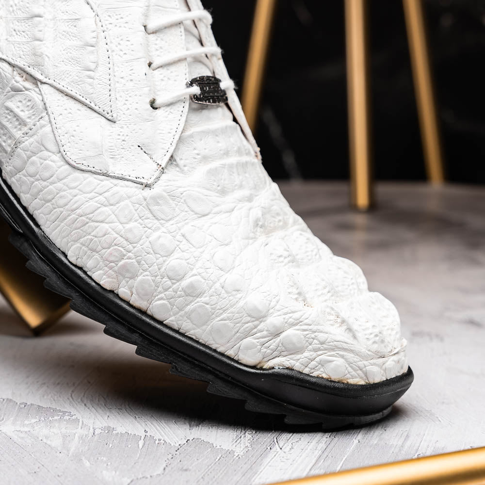 Kratos White by Marco Di Milano: luxury white crocodile-patterned leather dress shoes with black rubber soles—one upright, the other on its side.