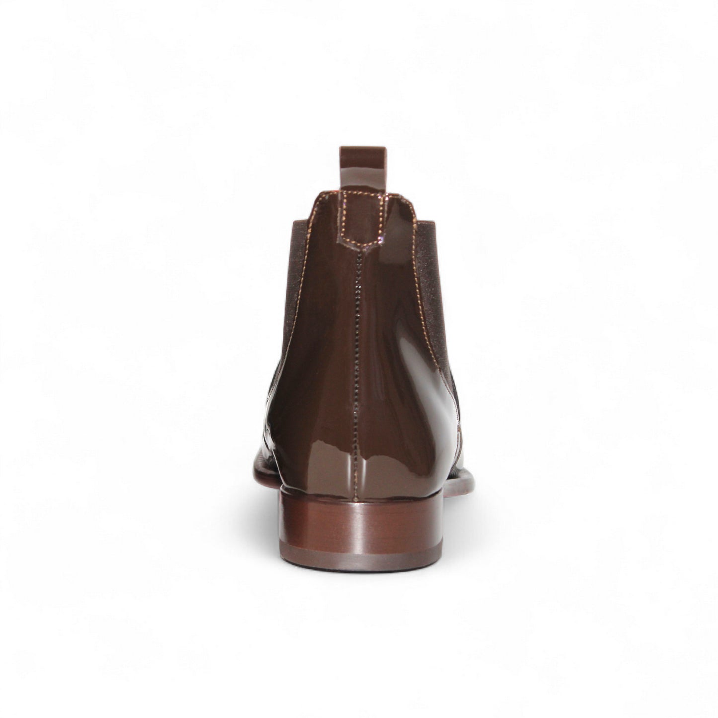 The Emilio Franco Leonardo Chocolate, a brown glossy Chelsea boot by Emilio Franco, showcases Italian craftsmanship with elastic side panels, a heel pull tab, and a low wooden heel, presented in side profile on a white background.