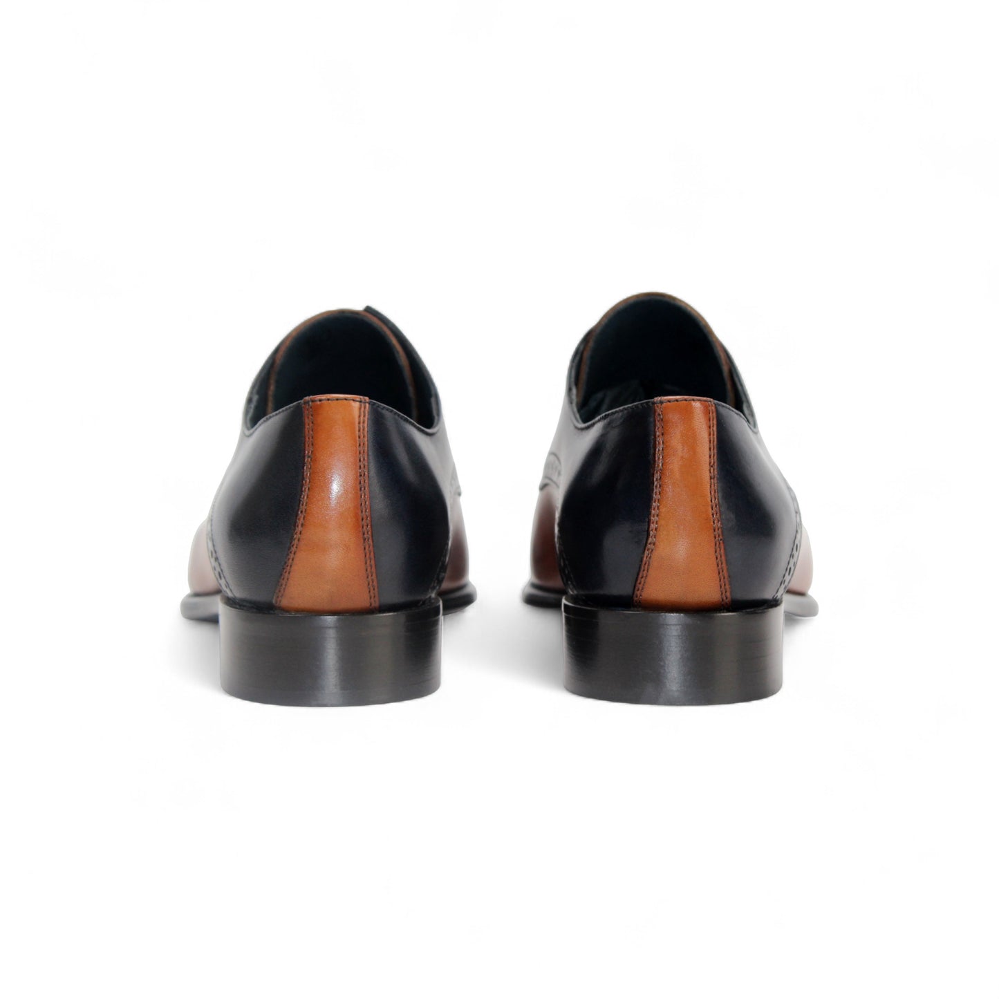 The Duca Di Matiste Duca Lombardi Blue/Cognac features genuine leather in blue and cognac panels, decorative perforations, a low heel, and a leather sole, captured on a white background.