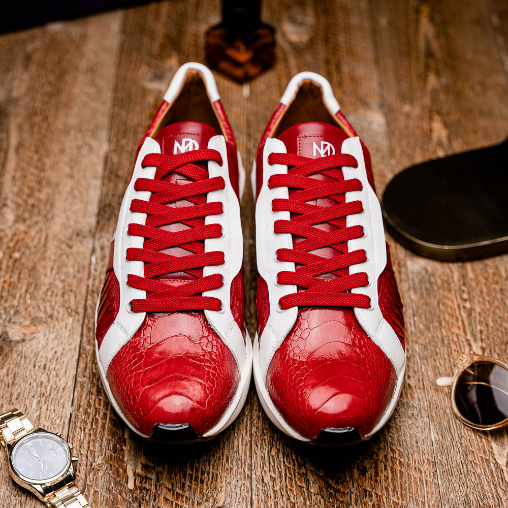 The Marco Di Milano Lyon Red / White are luxury low-top sneakers featuring a hand-painted finish, textured leather, white soles, red laces, and black tread, showcased on a plain white background.