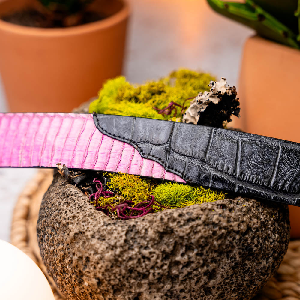 The Moncalieri Belt Pink / Gray by Marco Di Milano features a textured gray exterior, vibrant pink interior, and a silver logo-engraved buckle, showcasing the brand’s signature luxury style in genuine alligator and cobra skin.