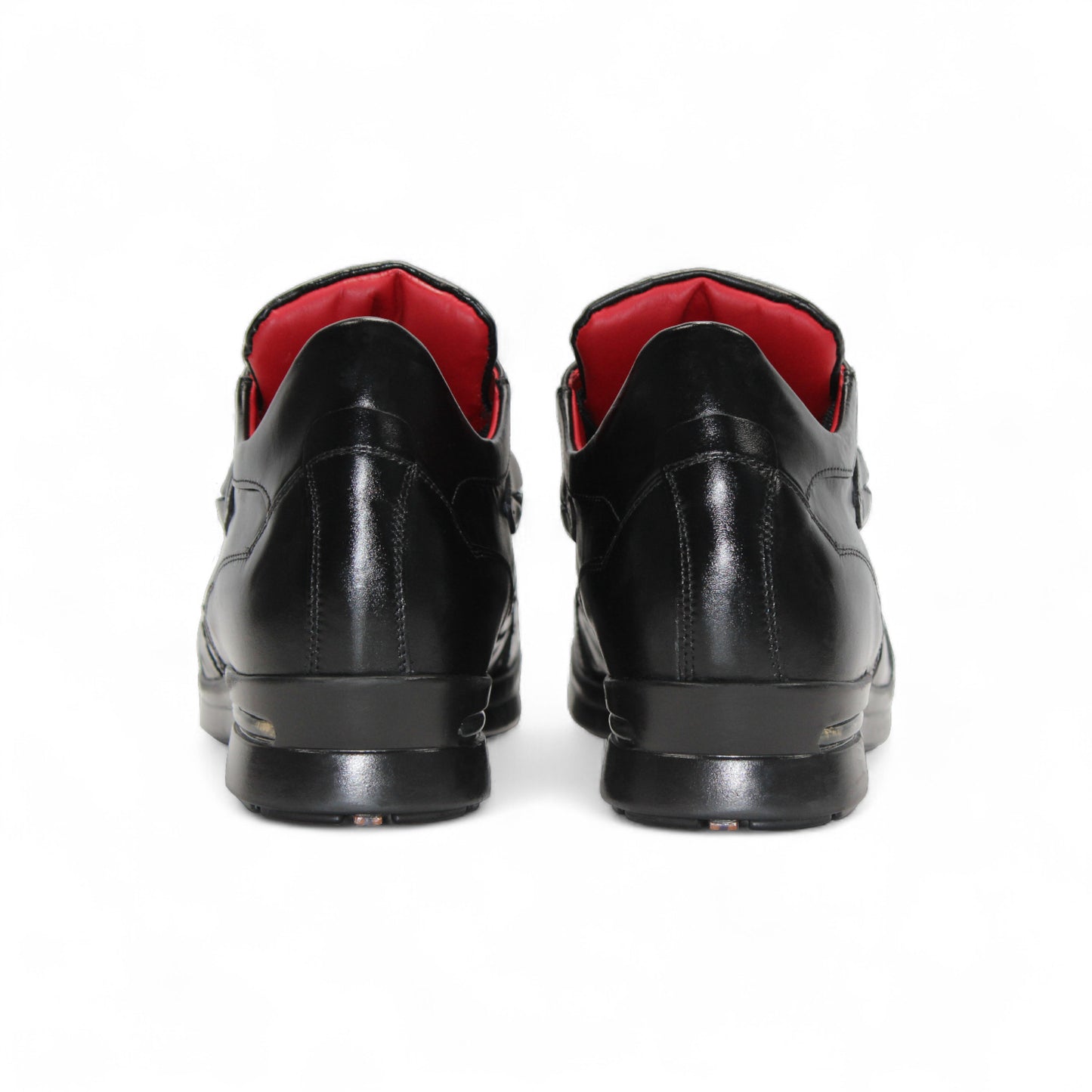 The Fennix Mason Black by Fennix of Italy is a black leather sneaker with textured detail, black laces, low heel, and red inner lining—an elegant modern style shown in profile on a white background.