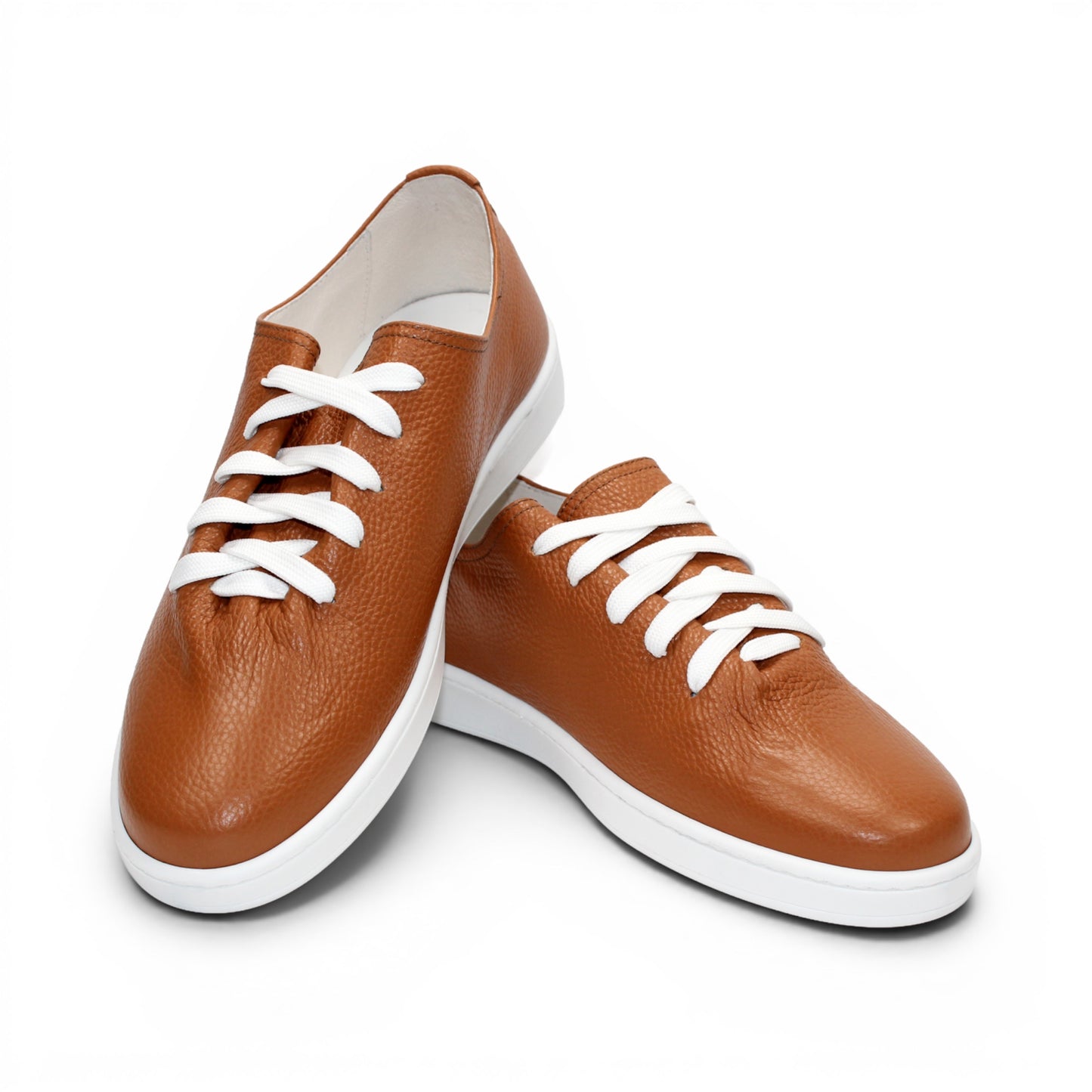 The Duca Max Camel by Duca Di Matiste—a brown Italian leather sneaker with white laces and a white rubber sole—offers a refined, contemporary look, shown in profile against a plain white background.
