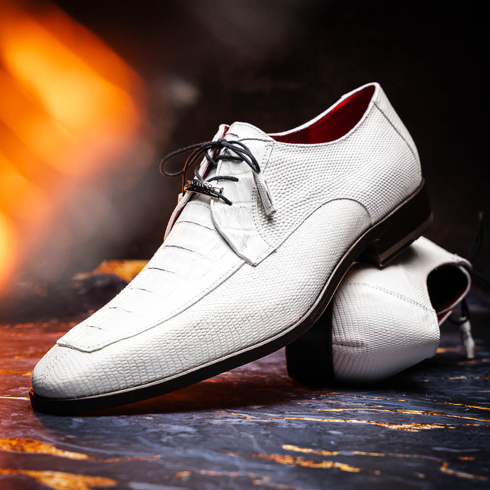 The Merida White by Marco Di Milano: luxury white textured leather caiman derby shoes with black soles, black laces, and brown leather outsoles, displayed with one shoe on its side.