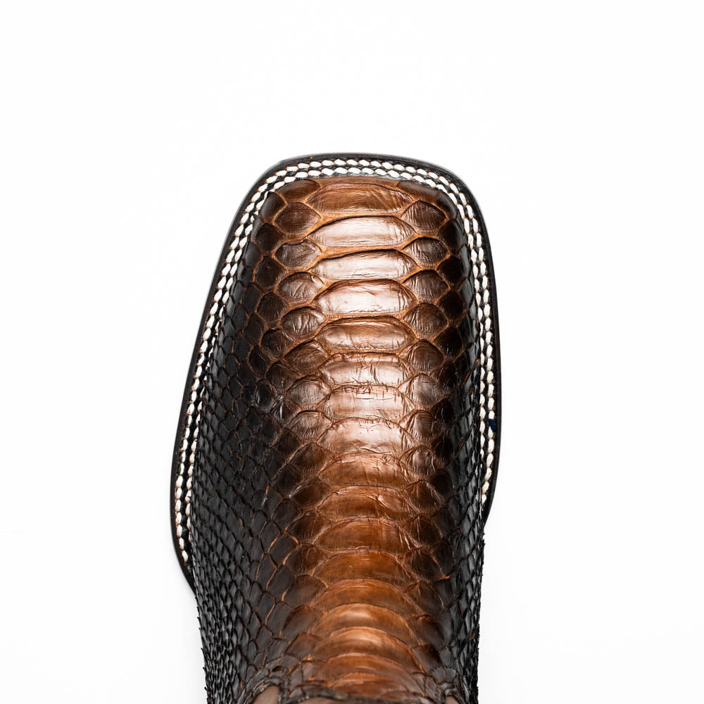 The Missouri Lisboa by Marco Di Milano offers men's cowboy boots with a textured snakeskin-style lower section, smooth upper, and a branded sole for a unique, handcrafted look.