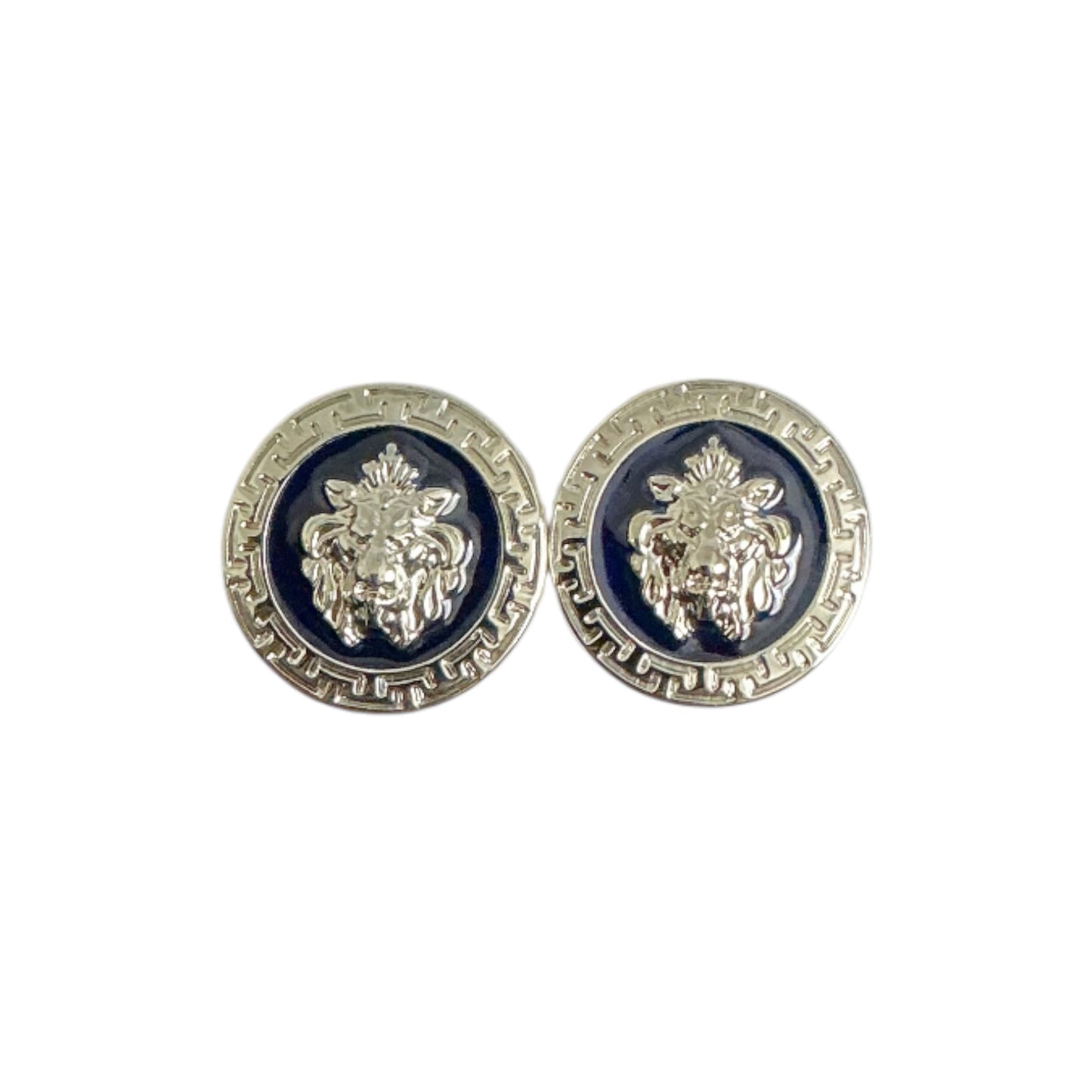 A pair of Matiste Navy/Silver Cufflinks by Matiste featuring round metallic buttons with a raised lion head design, inspired by Italian style, displayed on a dark background.