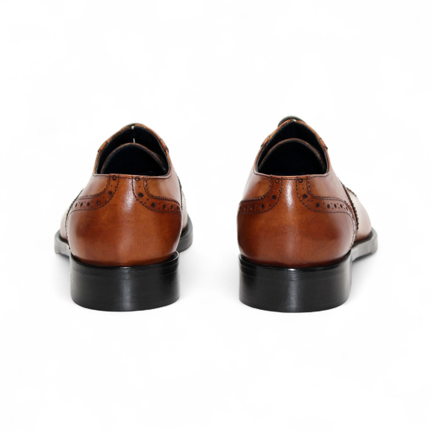 The Firmani Paul Cognac men's dress shoe by Firmani features genuine leather, decorative brogue detailing, black sole, and laces, displayed in a side profile view on a white background.