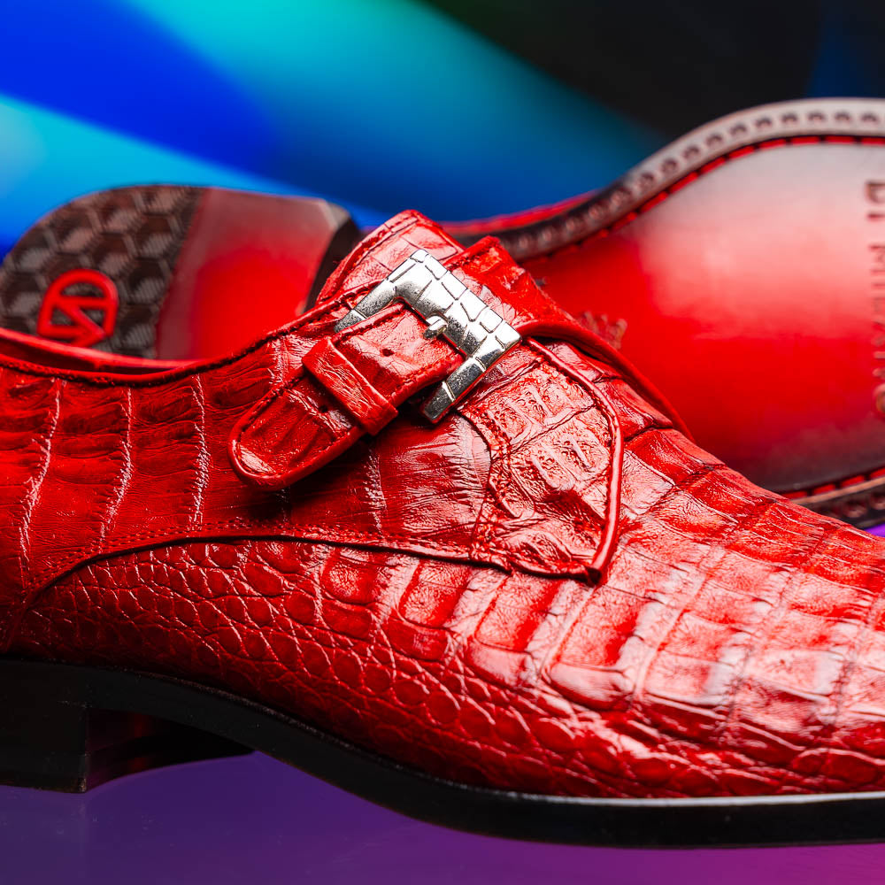 A pair of luxury Marco Di Milano Rovigo Red men's dress shoes in genuine caiman crocodile leather: one upright, the other on its side revealing the elegant sole.