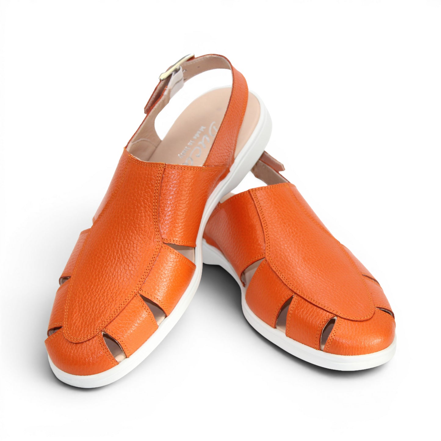 The Duca Di Matiste Duca SA131 Orange sandal features orange leather, open toe, side cutouts, a white sole, and an adjustable ankle strap with buckle. Displayed on a white background.