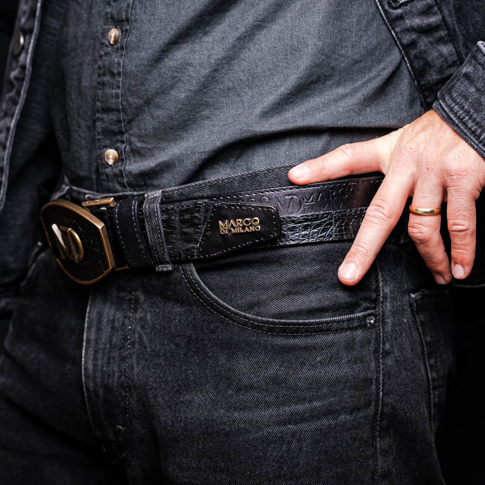 The Texas Belt Black by Marco Di Milano features a bold gold "MD" buckle and embossed branding, styled like a Western belt for a striking statement.