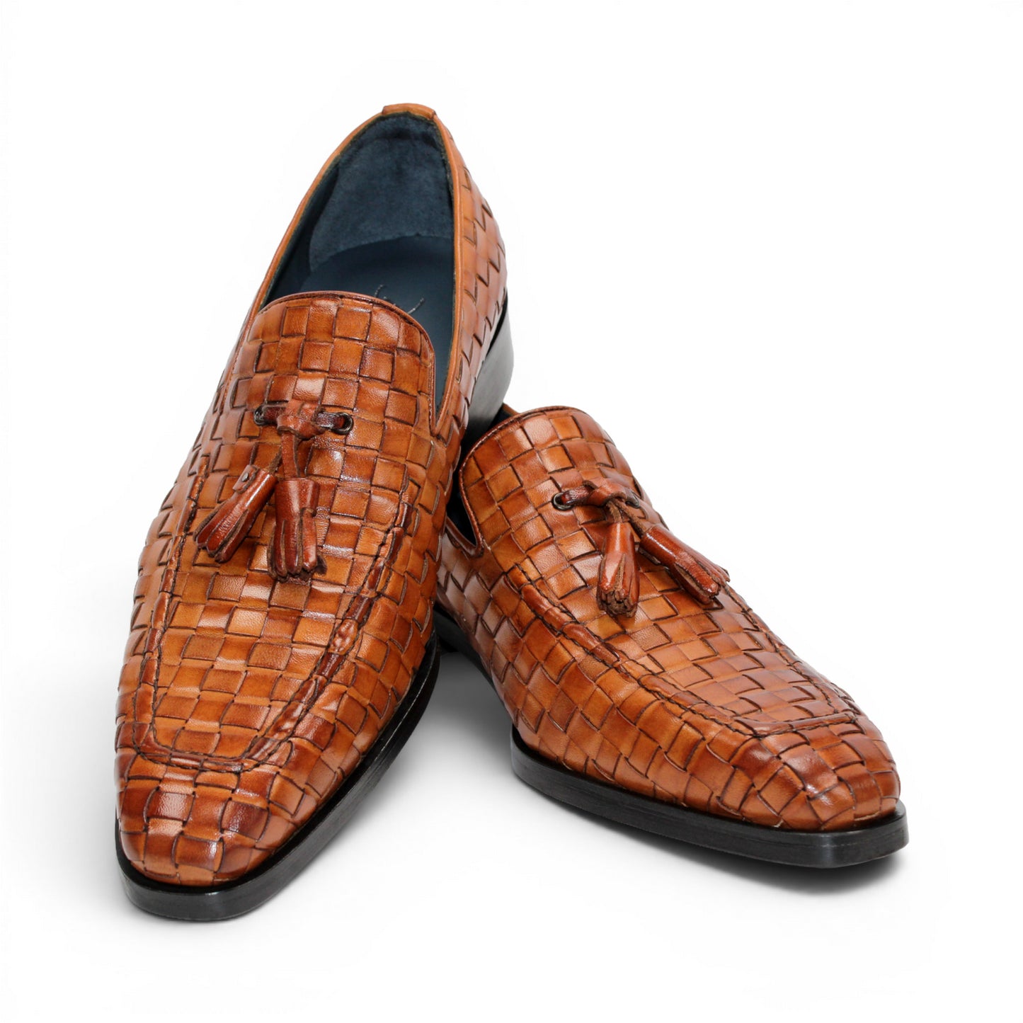 Duca Di Matiste's Duca Tirrenea Cognac: a brown Italian calf weave leather loafer with tassels, low heel, and black sole—luxury footwear shown in side profile on a white background.