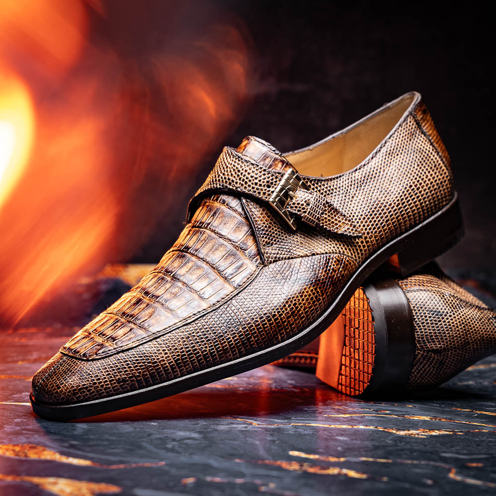 A pair of Toluca Rustic Orix brown leather monk strap shoes by Marco Di Milano, featuring a crocodile pattern—one upright and one showing the branded sole—luxurious footwear perfect for any occasion.