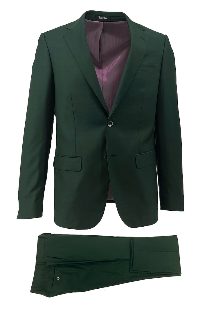 The Tiglio Luxe Forest Green Novello men's suit (TIG4186) is a modern fit, pure wool two-piece with matching blazer and pants, crafted from fine Italian fabrics and styled with a single-breasted design and mauve lining.
