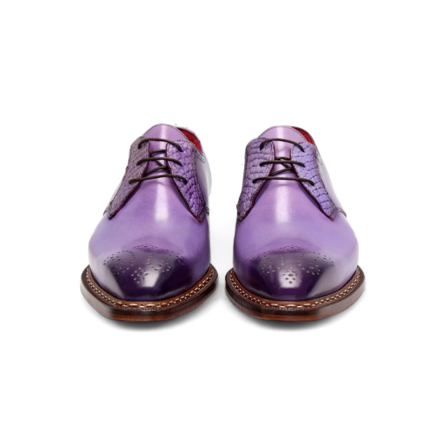The Fennix of Italy Fennix Tyler Lavender is a single purple leather dress shoe with brogue detailing, Italian craftsmanship, red inner lining, and a brown leather sole, shown on a white background.
