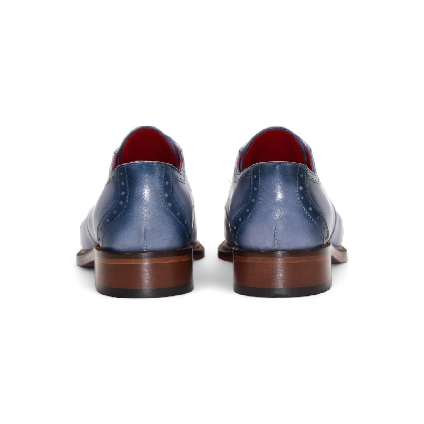 The Fennix Tyler Light Blue by Fennix of Italy is a premium leather dress shoe in light blue, featuring brown laces, a brown sole, and subtle brogue detailing—an elegant display of Italian craftsmanship photographed on a white background.