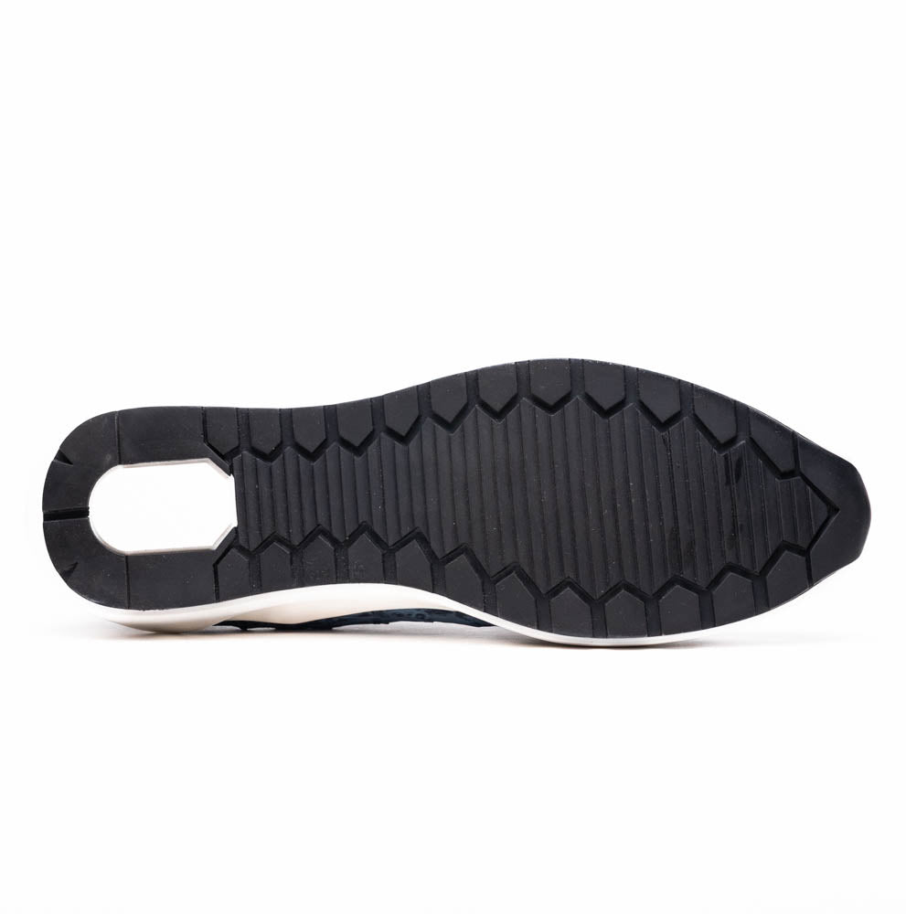 A pair of Marco Di Milano Varenna Blue Jeans sneakers—blue handcrafted leather with white soles and black laces—one upright, the other propped to display its sole.