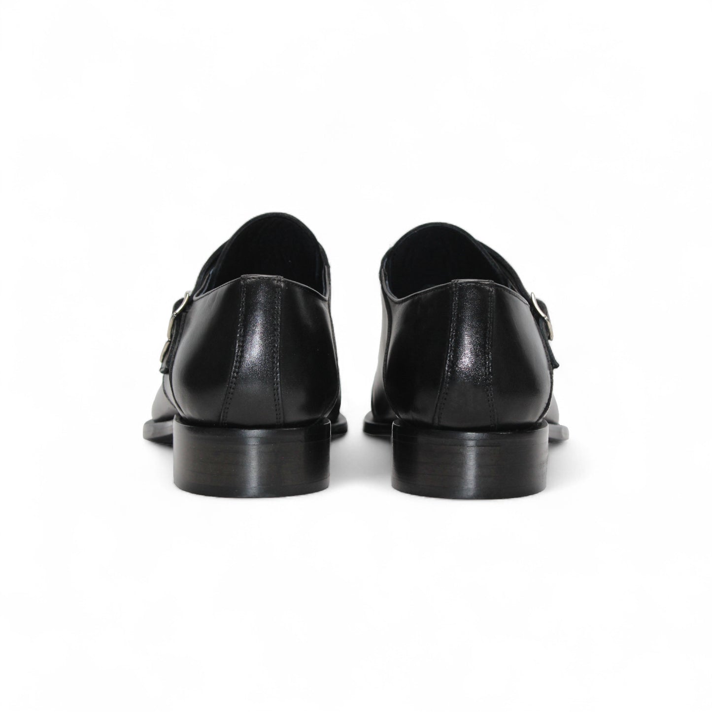 The Duca Vergato Black by Duca Di Matiste is an Italian leather double monk strap dress shoe with two buckles, a low heel, and almond toe, crafted from genuine leather and shown on a white background.