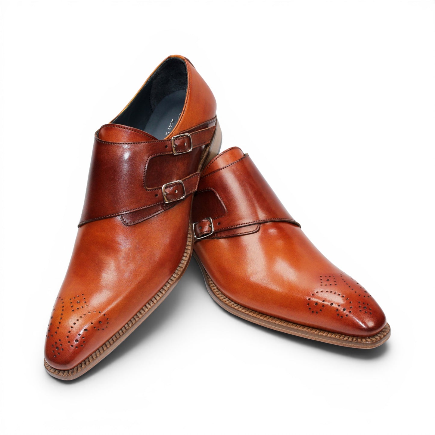 The Duca Vergato Gold/Brown by Duca Di Matiste is an Italian leather monk strap dress shoe in brown, featuring two buckles and decorative perforations on the toe, displayed on a white background.