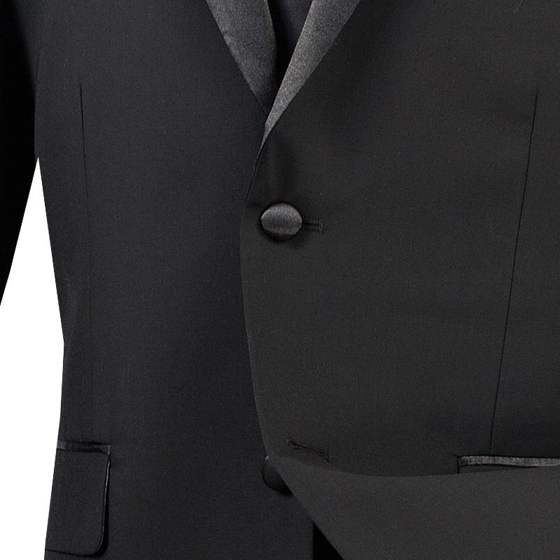 The Slim Fit 2 Piece (Black) Tuxedo by Vinci Suits, model T-SC900, is elegantly displayed on a mannequin. It features wrinkle-resistant fabric, satin lapels, a crisp white shirt, and a classic black tie against a plain background.