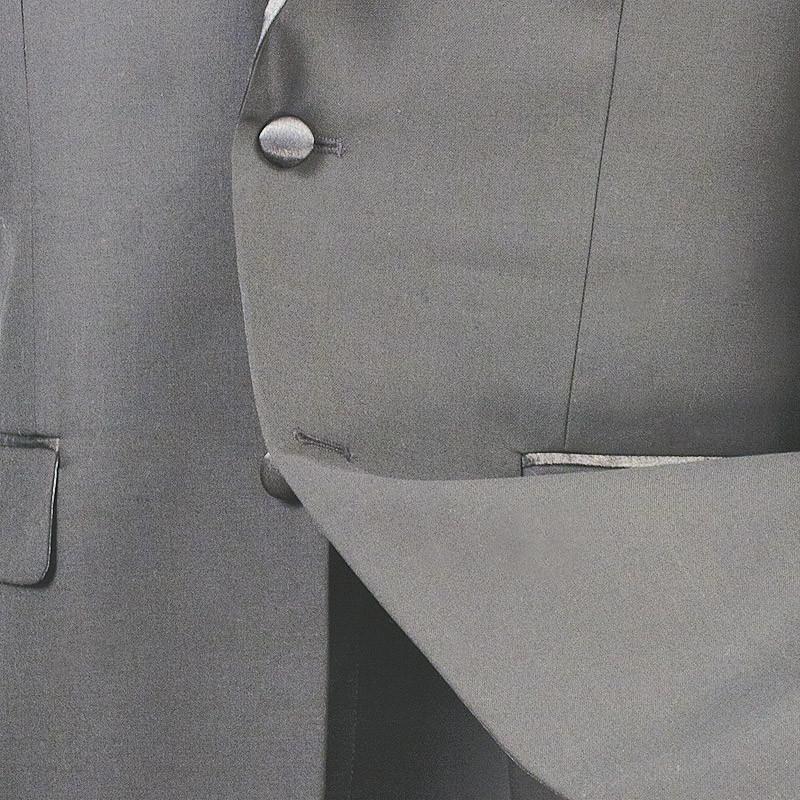 A mannequin displays a sleek Vinci Suits Slim Fit 2 Piece Tuxedo (Gray) T-SC900, featuring a tie, white shirt, shiny lapels, and a perfectly tailored one-button jacket for an elegant modern look.