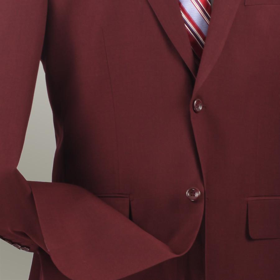 The Vinci Suits' Regular Fit 2 Piece Burgundy Suit (2LK-1) features a notch lapel and flat front pants, paired with a white shirt and red striped tie, all elegantly displayed on a wooden mannequin.