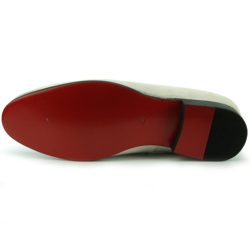 The FI-7355 Beige Suede Fiesso by Aurelio Garcia from the brand Fiesso is a shoe featuring a low heel, cushioned insole, and decorative multicolored beaded embellishment on the upper.