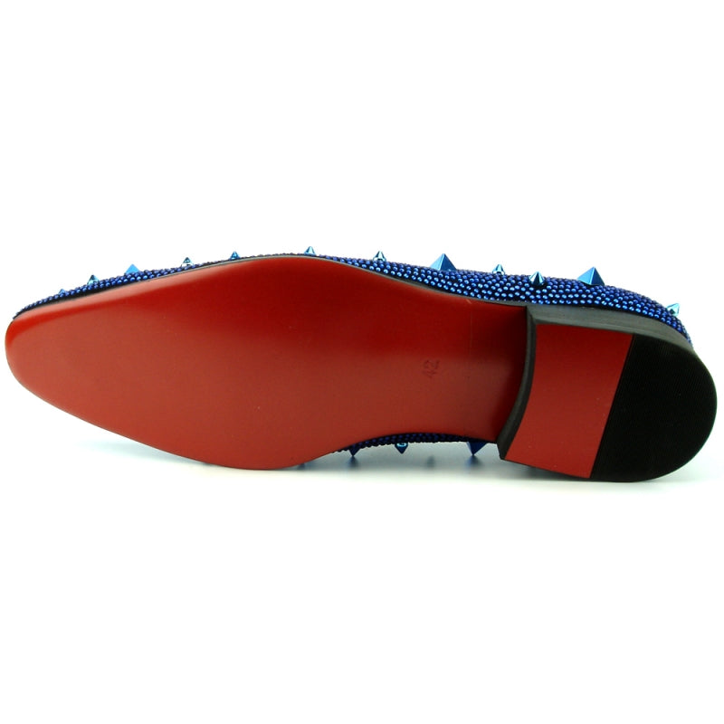 A blue suede slip-on shoe from Fiesso, the FI-7364-R Black/Blue Fiesso by Aurelio Garcia, embellished with shiny studs and pyramid-shaped spikes on the upper surface, offering a touch of fashion-forward elegance.