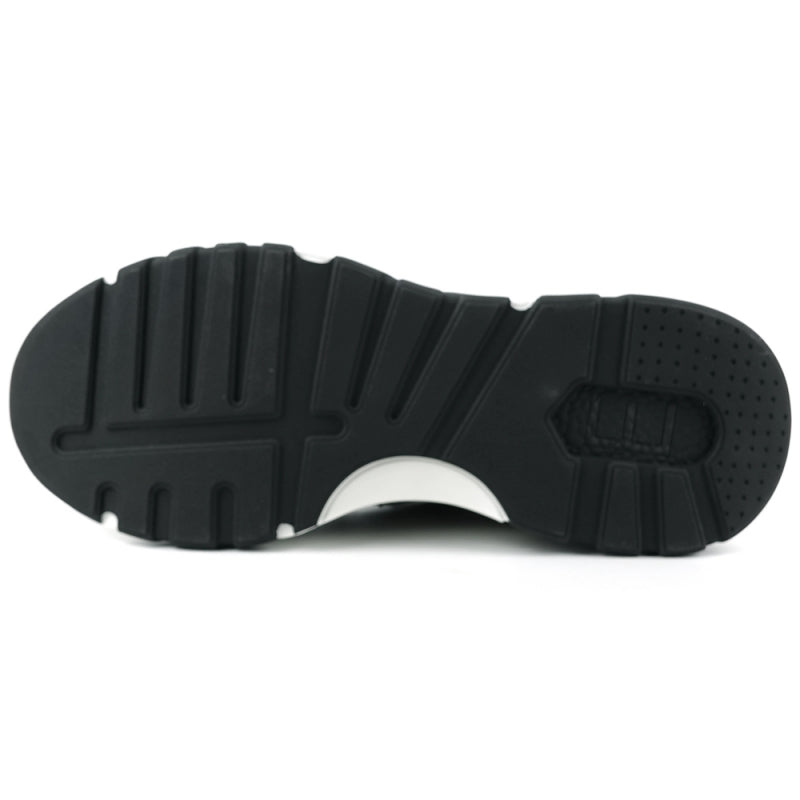 The FI-2407 Black Encore by Fiesso is a men's casual sneaker featuring a black and white design with suede detailing and rhinestone embellishments, complete with a thick black and white sole.