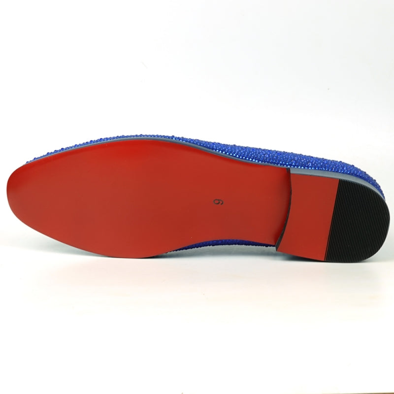 The FI-7525 Blue Suede Blue Rhinestones Slip on Loafer by Fiesso is a stunning creation featuring dazzling rhinestones, a vibrant red interior lining, and a sleek black sole.