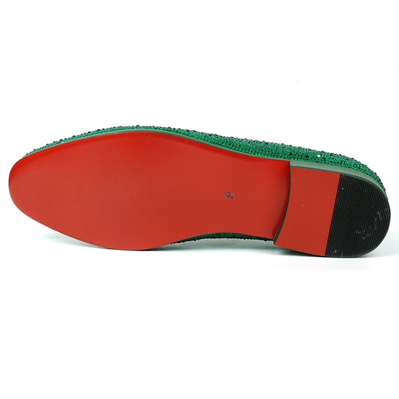 The FI-7525 Slip on Loafer by Fiesso, crafted from green suede and decorated with small sparkling rhinestones, boasts a striking red interior lining.