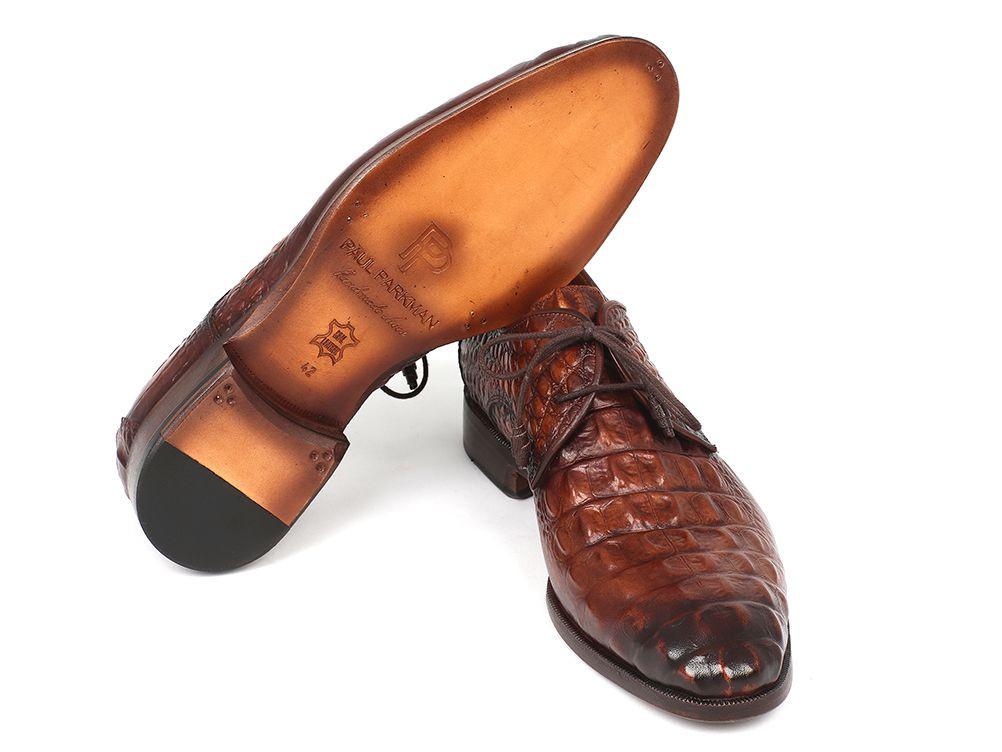 The Paul Parkman Light Brown Crocodile Embossed Calfskin Derby Shoes - 1438TAB showcase elegant laces and are made from hand-painted leather, set against a pristine white background.