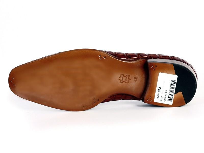 The Paul Parkman Brown Crocodile Embossed Calfskin Tassel Loafers - 0823-BRW, showcased from top and side views, exude sophistication. These bespoke loafers, designed for connoisseurs of quality craftsmanship and timeless elegance, feature exquisite tassels.