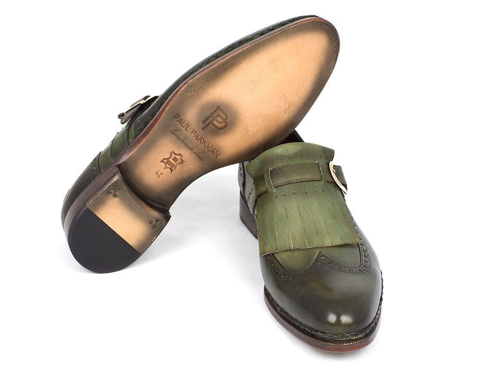 A pair of Paul Parkman Wingtip Monkstrap Brogues in green leather, hand-painted and adorned with fringe and buckle details against a white background, showcasing exquisite wingtip perforations.
