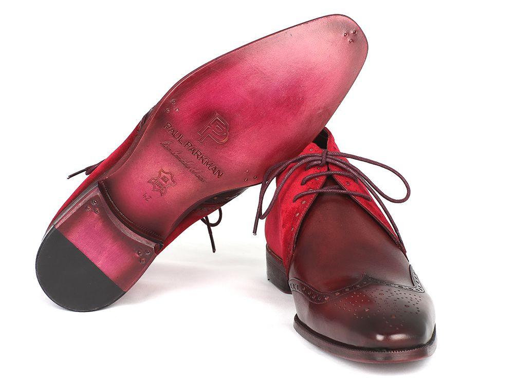 A pair of Paul Parkman Chukka Boots in Bordeaux suede and leather, the CK51-BRD model showcases elegant wingtip design with decorative perforations and dark laces, adding a touch of sophistication.