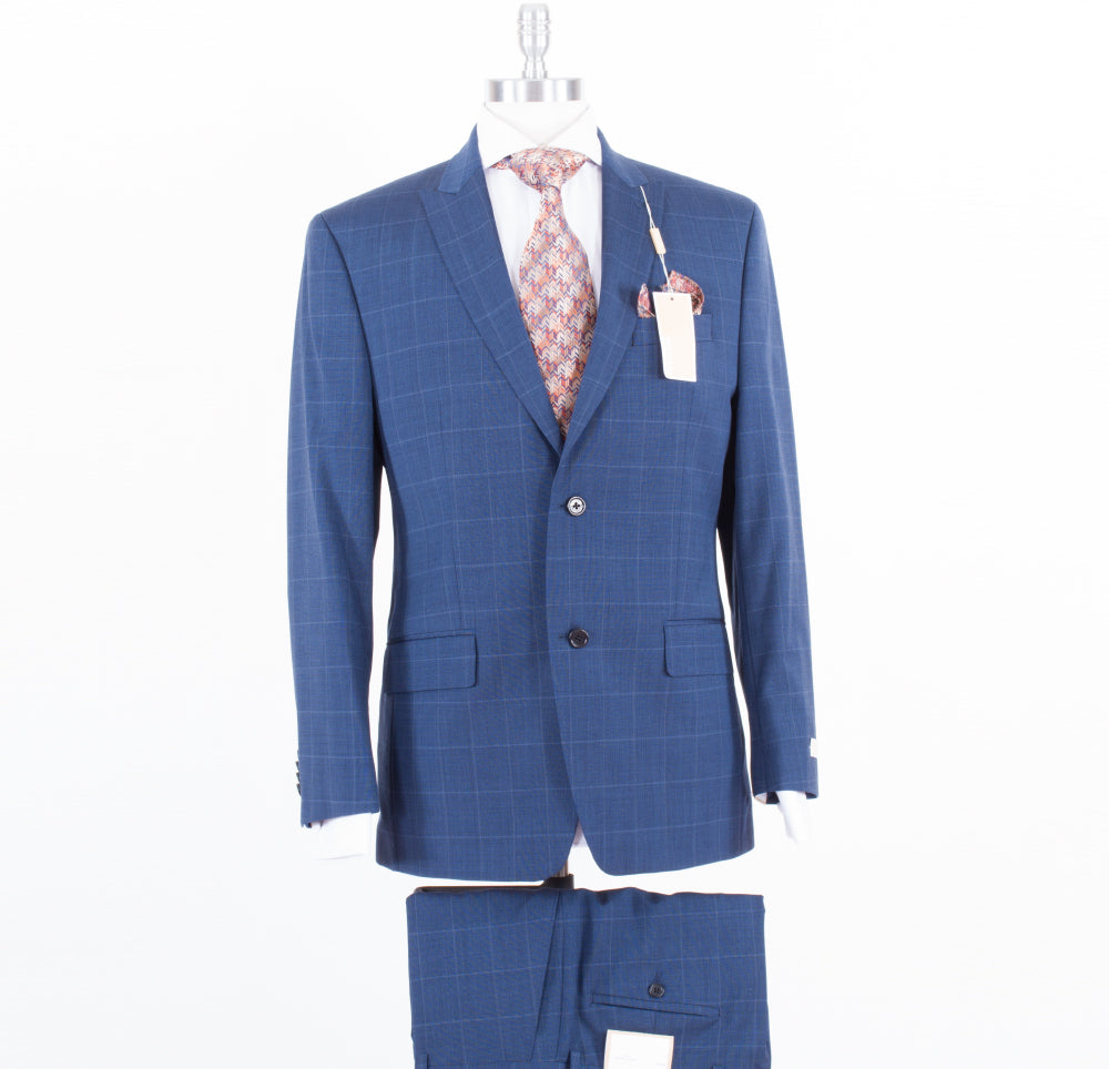A blue windowpane Michael Kors suit displayed on a mannequin, featuring a patterned tie and pocket square. The modern fit suit, labeled "Michael Kors Modern Fit Blue Window Pane KBRE2K2Z1248," has a tag attached to the lapel, with matching flat front pants shown below.