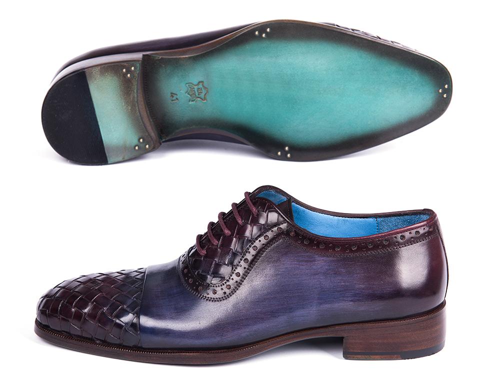 A pair of Paul Parkman Woven Leather Captoe Oxfords in Navy & Purple, meticulously crafted from hand-painted leather with intricate woven details and a gradient transition from dark blue to burgundy, featuring a low heel and blue interior lining.