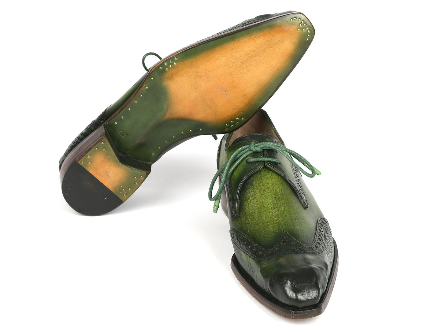 The Paul Parkman Goodyear Welted Wingtip Derby Shoes in Green, model 584-GRN by Paul Parkman, are featured against a white background. These handcrafted shoes, adorned with decorative perforations and laces, combine style and durability as an elegant made-to-order product.