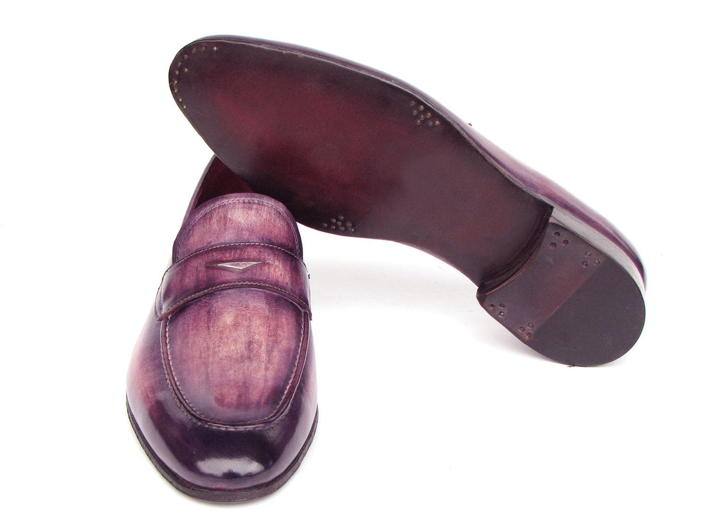A pair of Paul Parkman Men's Purple Patina Penny Loafers - 17PRP33, crafted from hand-painted leather with a strap across the front, displayed on a white background.