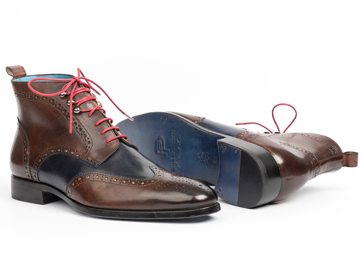 The Paul Parkman Wingtip Ankle Boots Dual Tone Brown & Blue (Model 777-BRW-BLU) feature a stylish side view with hand-painted leather in brown and navy, pink laces, and decorative perforations.