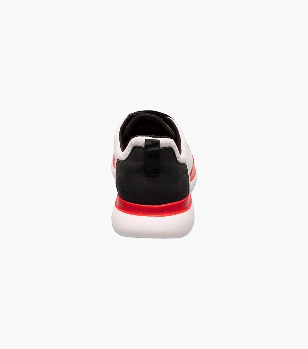 The Stacy Adams Maxson Moc Toe Lace Up Sneaker in White Multi features black laces, a black heel, brown toe cap, red sole accent, and arch support for comfort. Displayed on a white background. Brand: STACY ADAMS. Model: 25517-110.