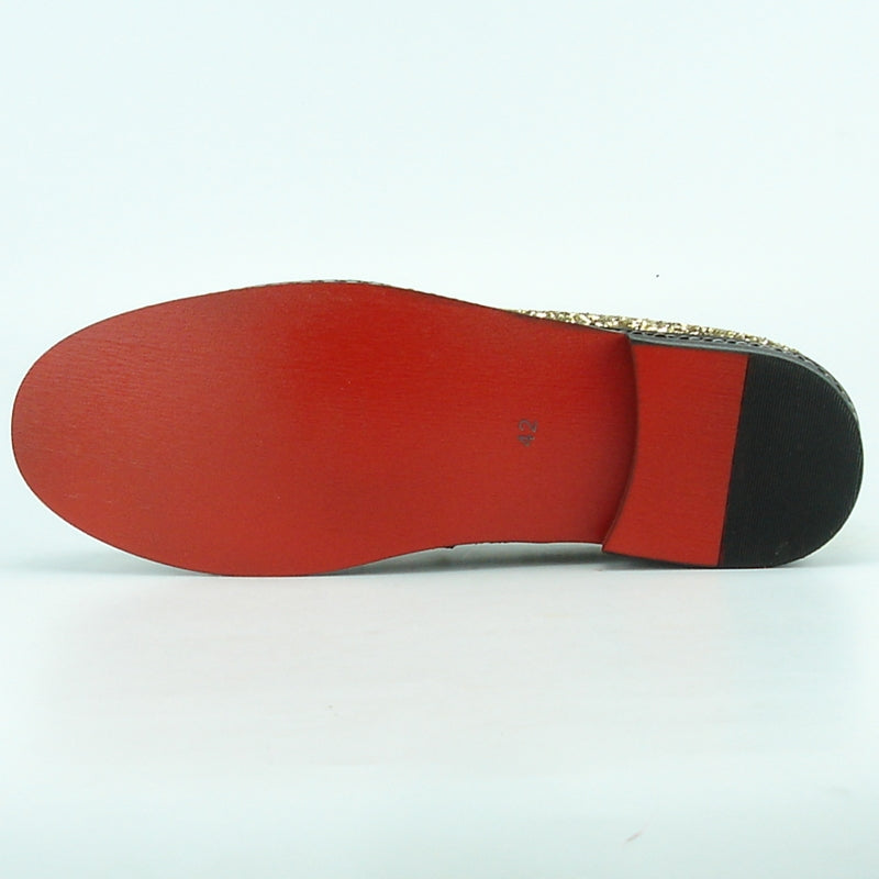 The FI-7118 Gold Fiesso by Aurelio Garcia, featuring a luxurious leather upper with a low heel and black sole, is displayed on a plain background.