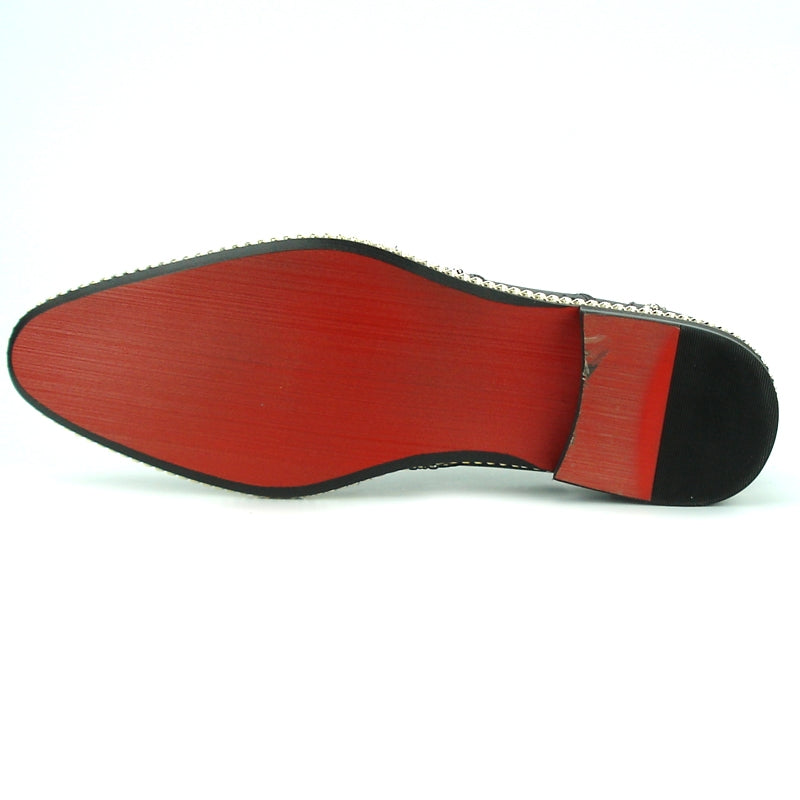 The FI-7201 Black Fiesso by Aurelio Garcia Shoes from the Fiesso brand feature black leather with a wingtip design, cushioned insole, silver stud detailing, decorative brogue pattern, and a braided trim along the sole.