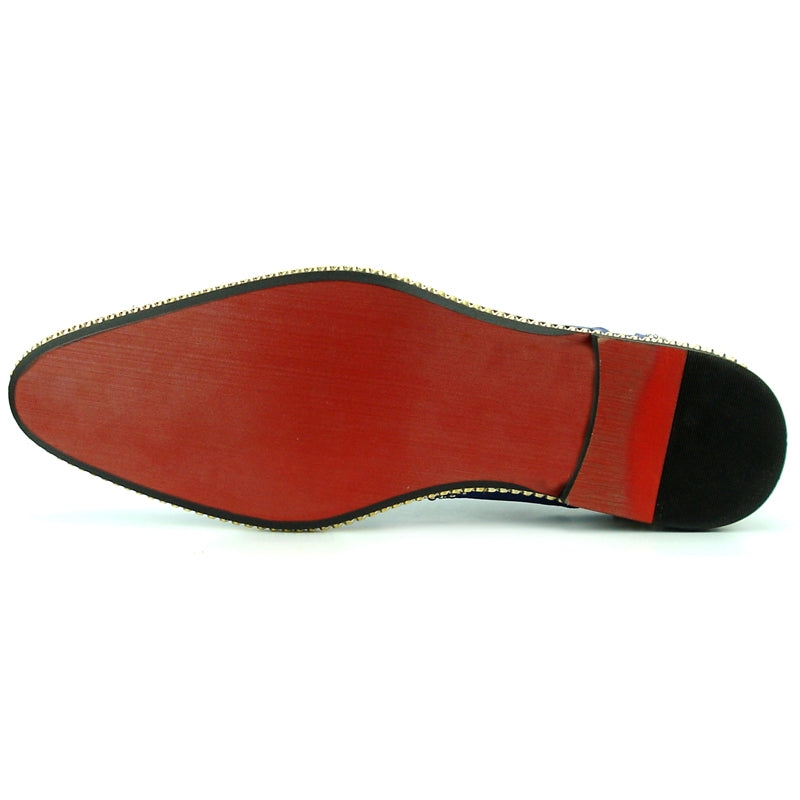 The FI-7201 Red Fiesso by Aurelio Garcia Shoes from the brand Fiesso are red leather dress shoes adorned with decorative perforations, gold studs, and black laces. They feature a black sole accented with a gold and white braided trim and a cushioned insole for added comfort.