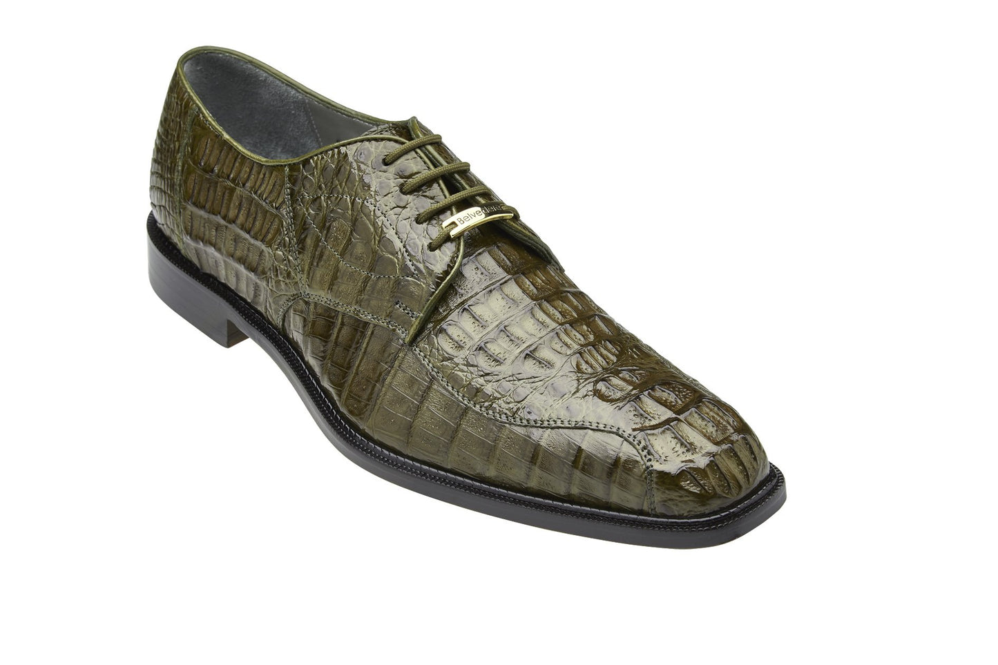 The Chapo dress shoe by Belvedere showcases a bold olive hue with a crocodile-patterned leather design, complete with a flat black heel. Crafted from genuine hornback crocodile, this shoe exudes luxurious sophistication, emphasized when viewed from the side.