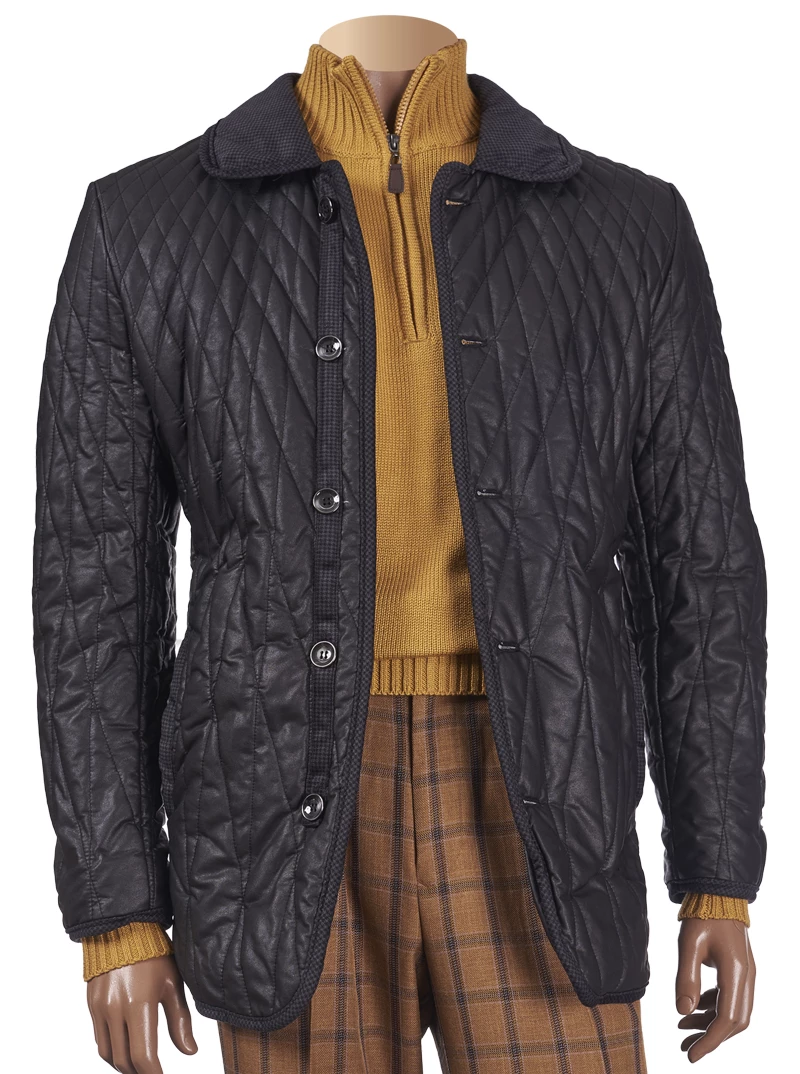A mannequin dressed in the Inserch Quilted Coat with Corduroy Trim 515-01 Black, a mustard sweater, and plaid trousers.