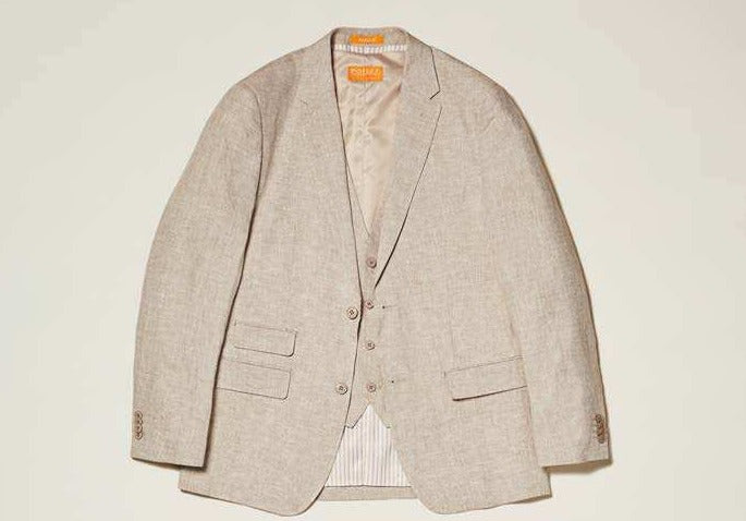 The Inserch Classic Linen Blazer SU66010-00006 Oatmeal by Inserch has a two-button front, notched lapels, and a matching vest. It features two flap pockets and one chest pocket, elegantly showcased on an oatmeal background.
