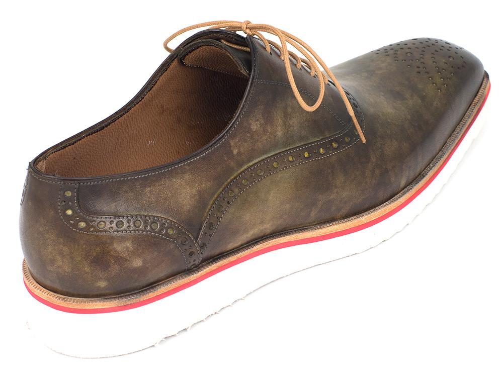 A pair of Paul Parkman Smart Casual Oxford Shoes in Army Green are displayed, highlighting intricate brogue detailing and vibrant red accents on the sole. One shoe is presented from above and the other from the side, perfectly capturing a blend of refined sophistication with casual charm.