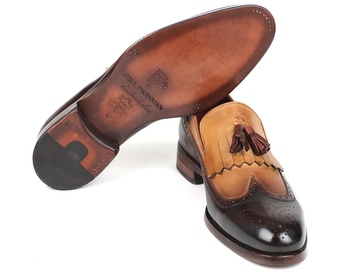 Paul Parkman Kiltie Tassel Loafers in beige and brown feature kiltie tassels and brogue detailing, meticulously crafted from hand-painted calfskin for a unique finish.